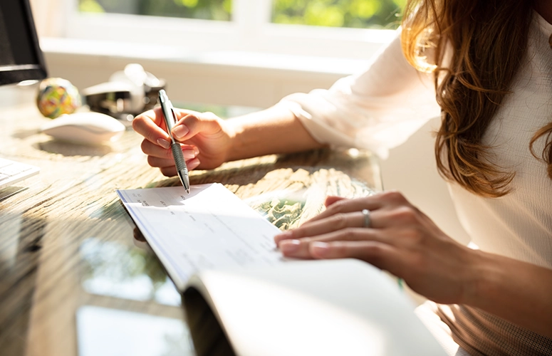 woman writing check