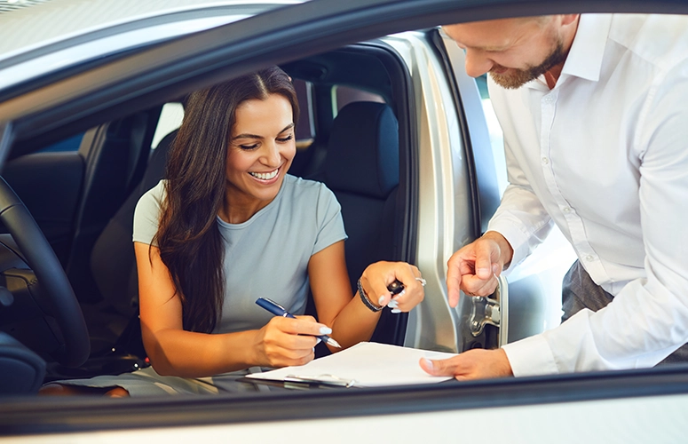 woman buying new car