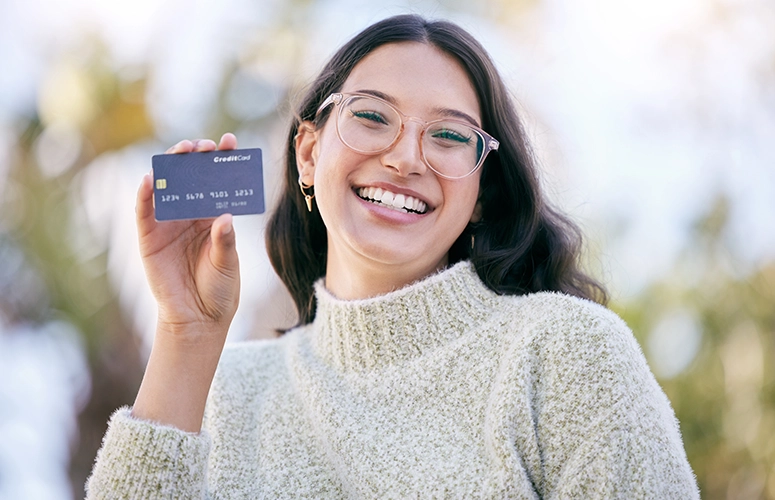 smiling woman with credit card