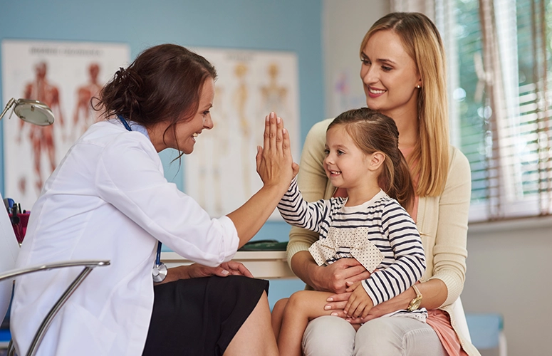 woman with daughter at doctors office